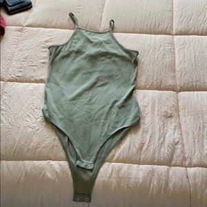 a green onesie size M